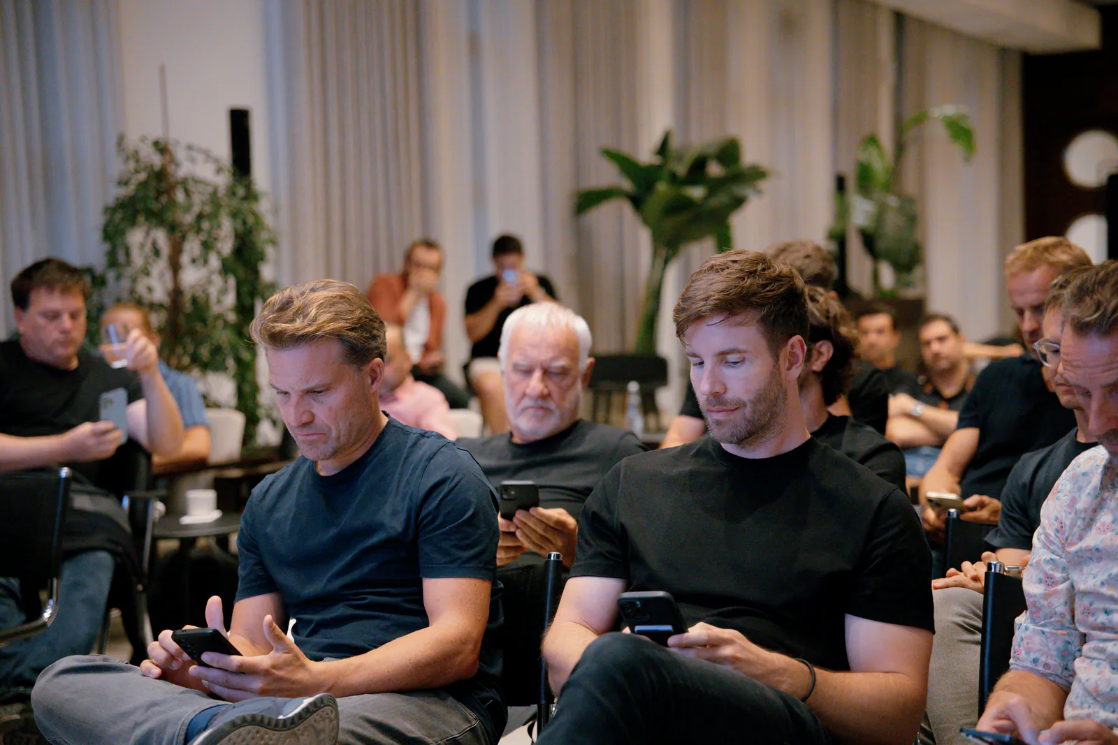 Entrepreneurs seated at an event at DotsHub